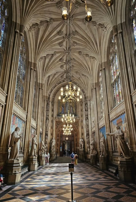 St Stephen's Hall looking towards Central Lobby, statues of parliamentarians lining both walls beneath the vaulted ceiling