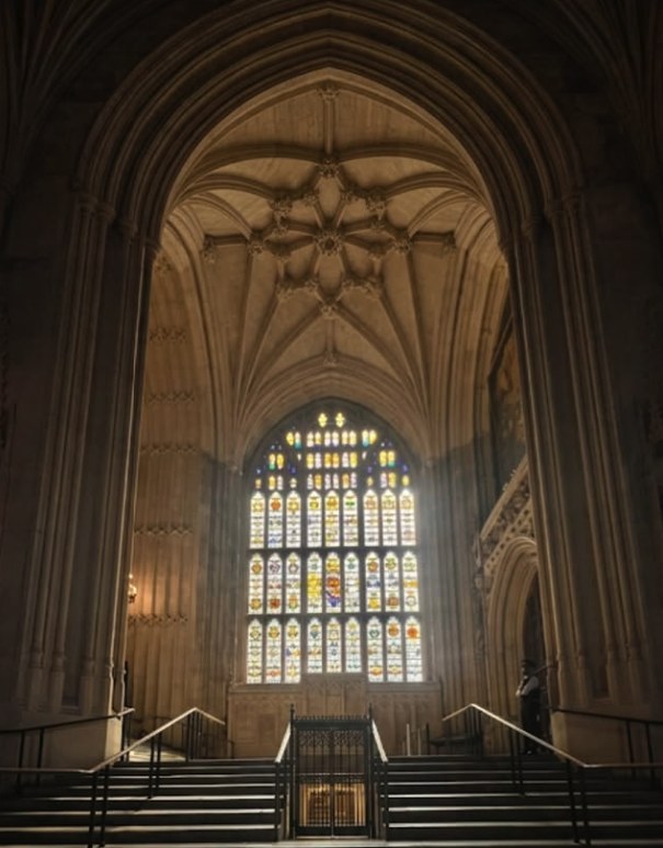 The great south window of Westminster Hall lit from outside, with the flight of steps rising towards St Stephen's Porch